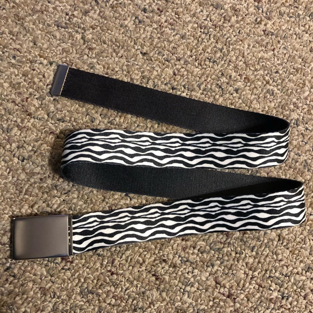 Zebra belt with bottle cap opener